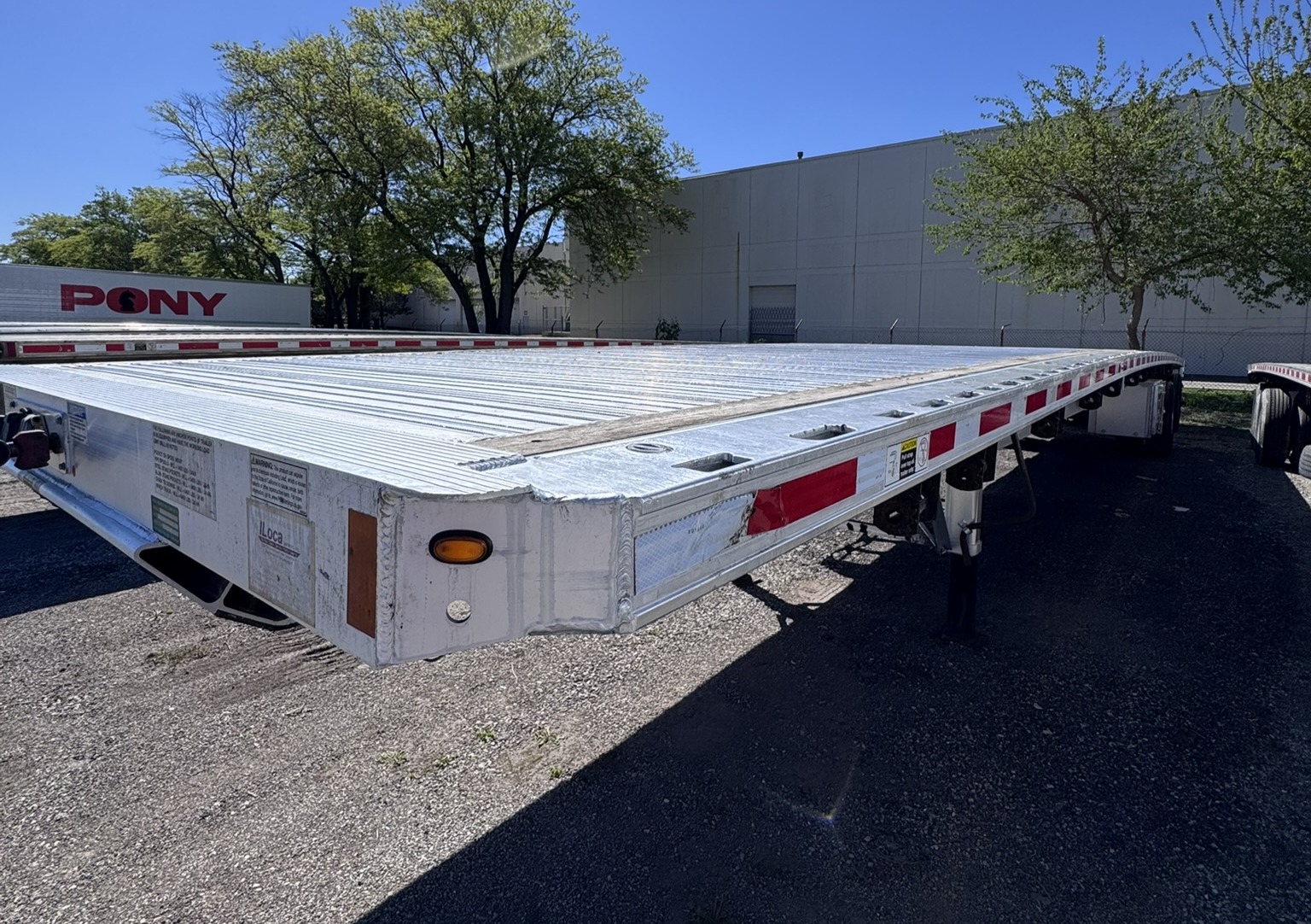 2023 Fontaine Revolution Aluminum Flatbed Trailer 53FT Air Ride Rear Axle Slide
